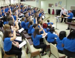 Mr. D. and his students at Henderson Middle School work on sight-singing techniques.