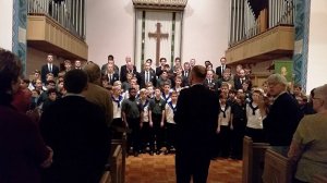 Photo: Michael Kleiner Sølvguttene Music Director Fredrik Otterstad leads Keystone Boychoir (in dark shirts) and Sølvguttene (white) in singing “Hallelujah.”